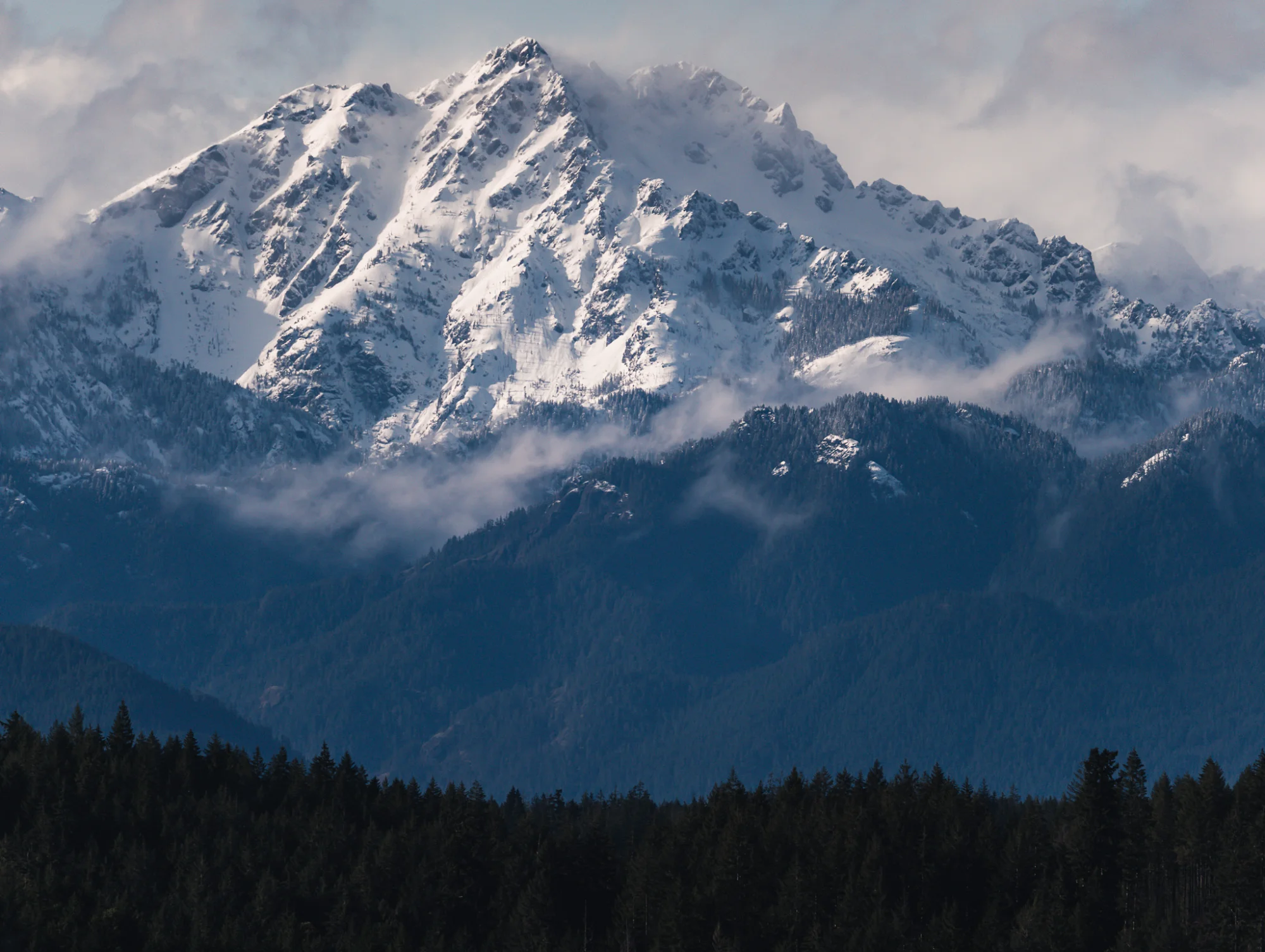 Olympic Mountains rising above Hood Canal at sunset